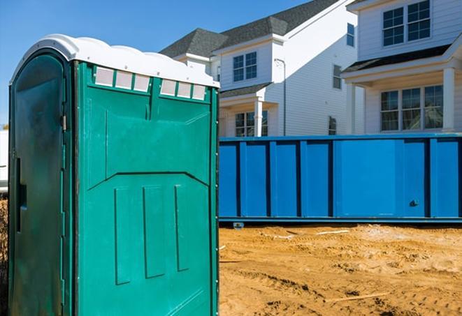 a row of portable toilets at a work site